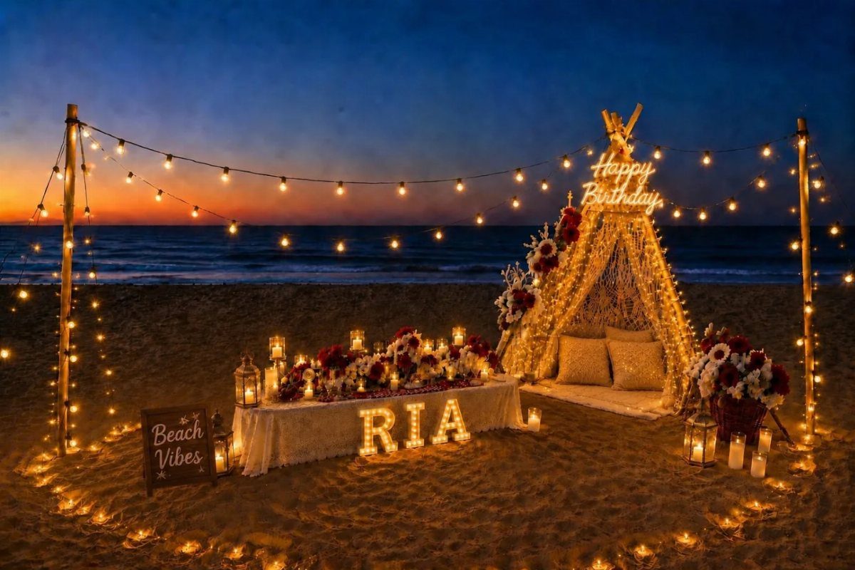 Evening beach party setup with string lights, glowing letters, and a lit teepee.