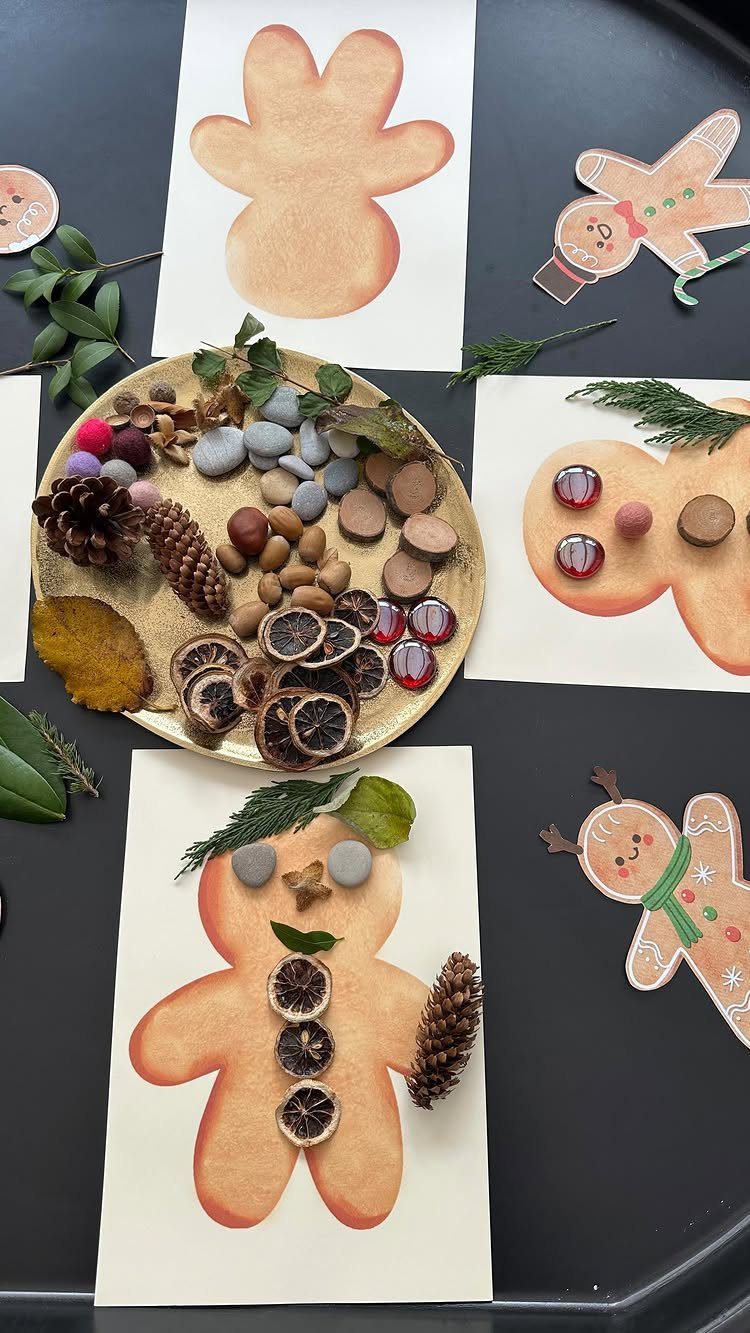 Paper gingerbread man crafts decorated with dried citrus, pinecones, and natural pebbles.