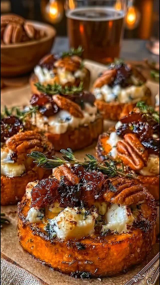 Roasted sweet potato rounds topped with goat cheese, pecans, cranberries, and fresh thyme.
