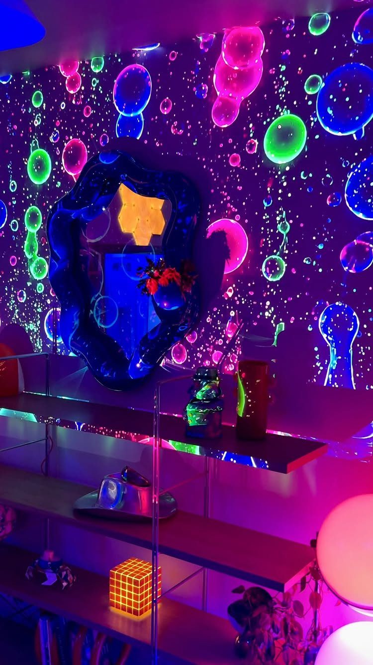 Neon purple and blue room with glowing bubble wall and colorful accent lighting