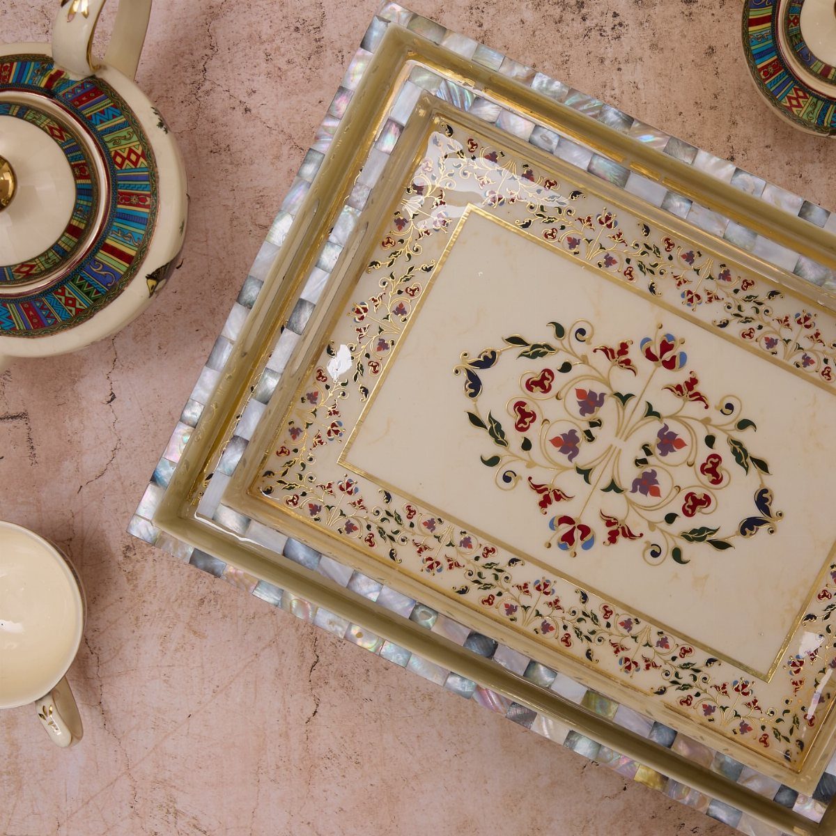 Ornate rectangular serving tray with floral patterns and mother-of-pearl inlaid borders.