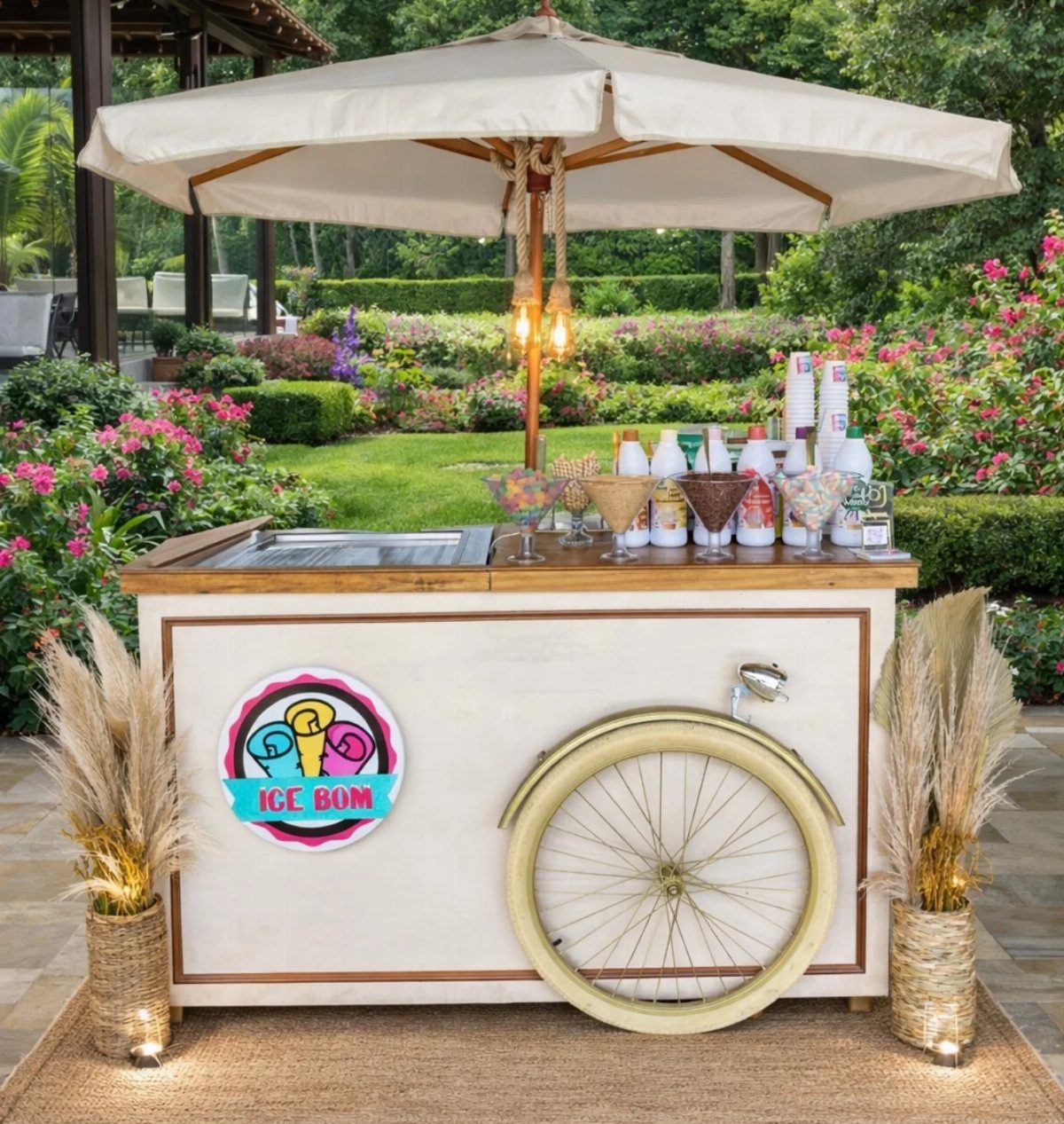 Ice cream cart with a bicycle wheel and umbrella in a flowering garden
