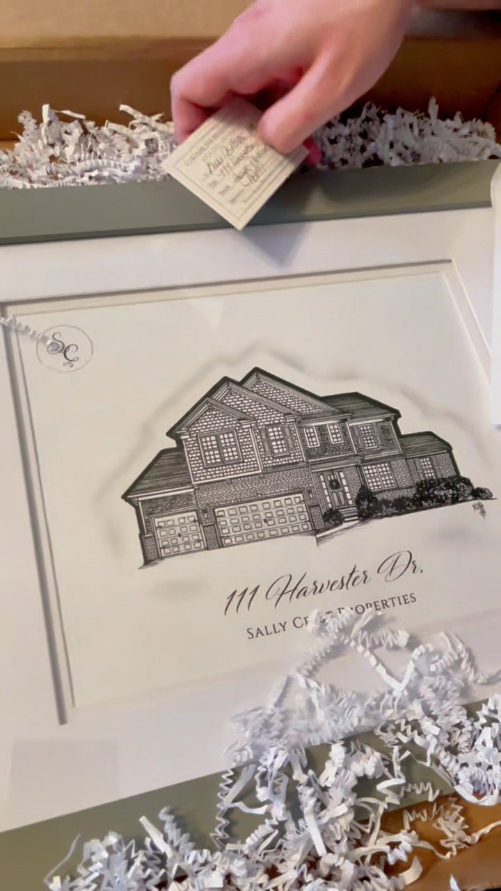 Framed custom house sketch with address in a gift box with packing paper