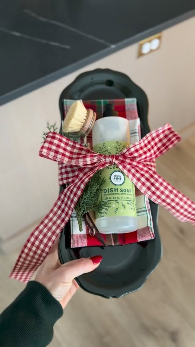 Gift set with dish soap and scrub brush tied with a gingham bow