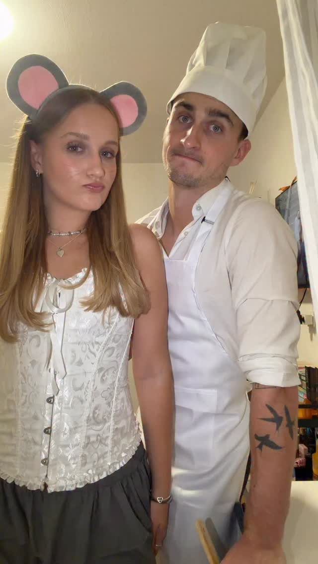 Woman with mouse ears and man in chef attire posing as Ratatouille characters.