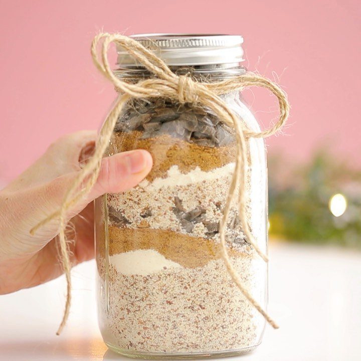 Layered dry ingredients in a mason jar tied with a twine bow.