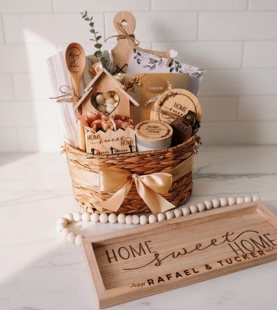 Woven gift basket with house-themed ornaments and a personalized wooden home sweet home tray