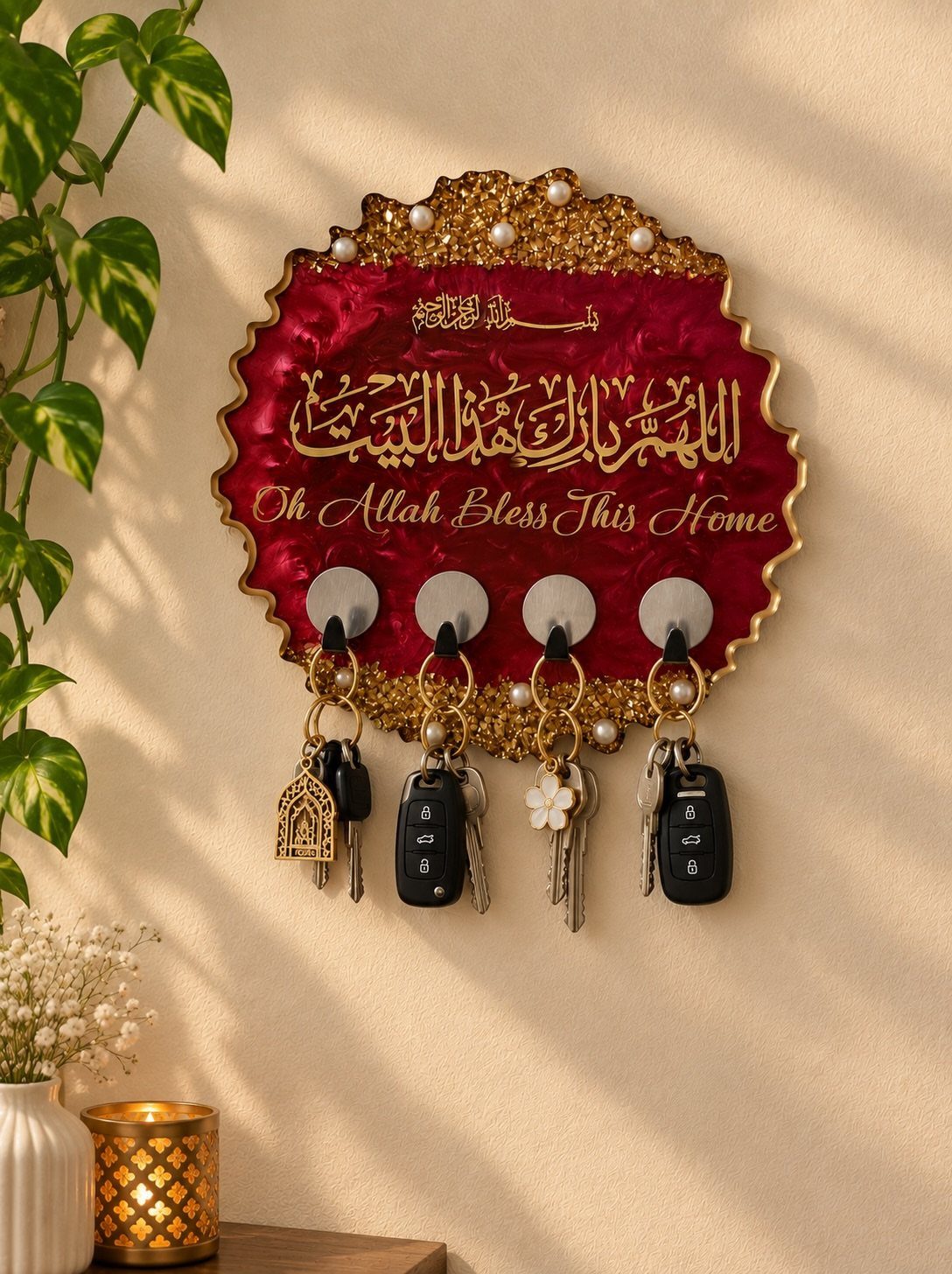 Decorative red and gold key holder with religious text and hanging keys on wall
