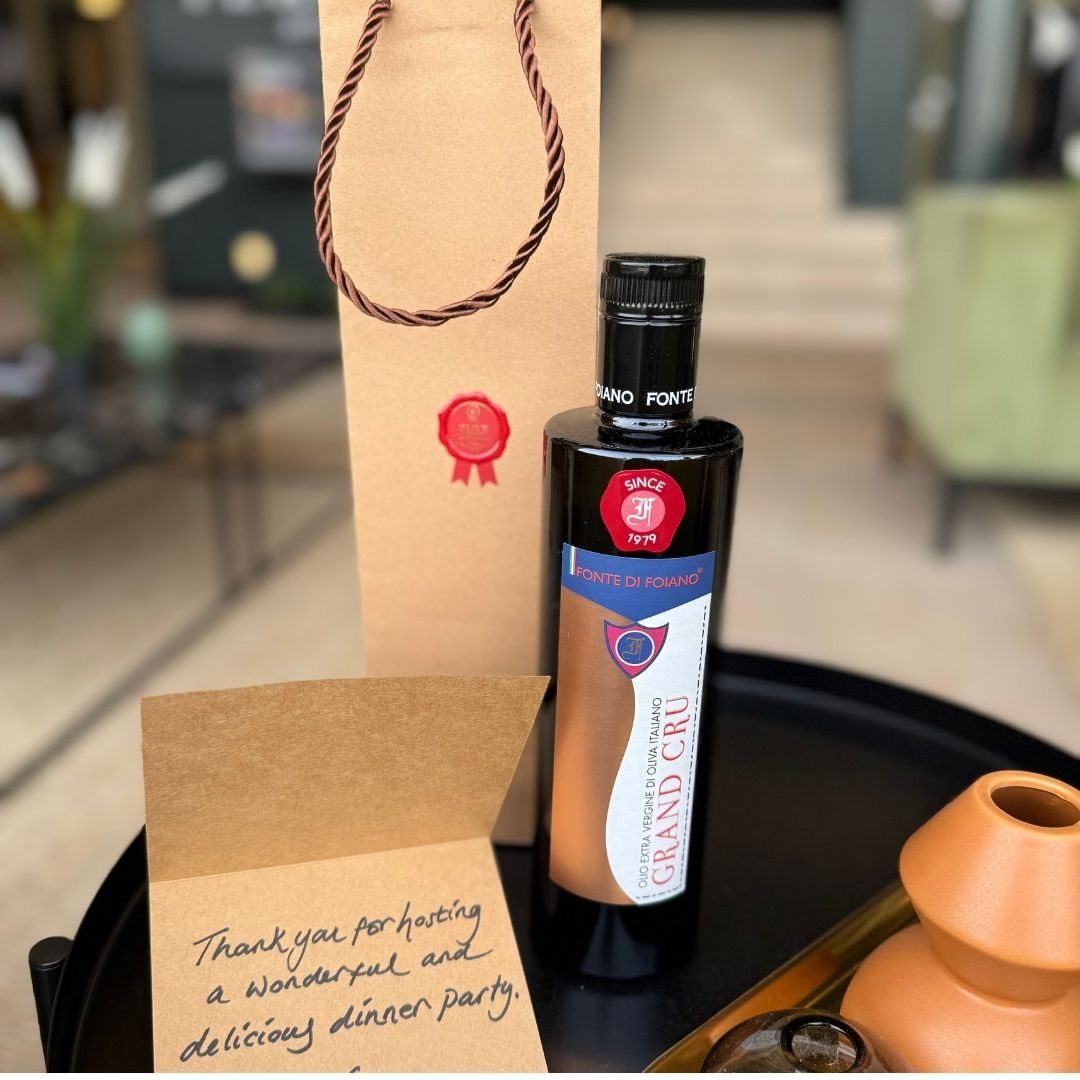 Bottle of Grand Cru olive oil with a gift bag and thank you note.