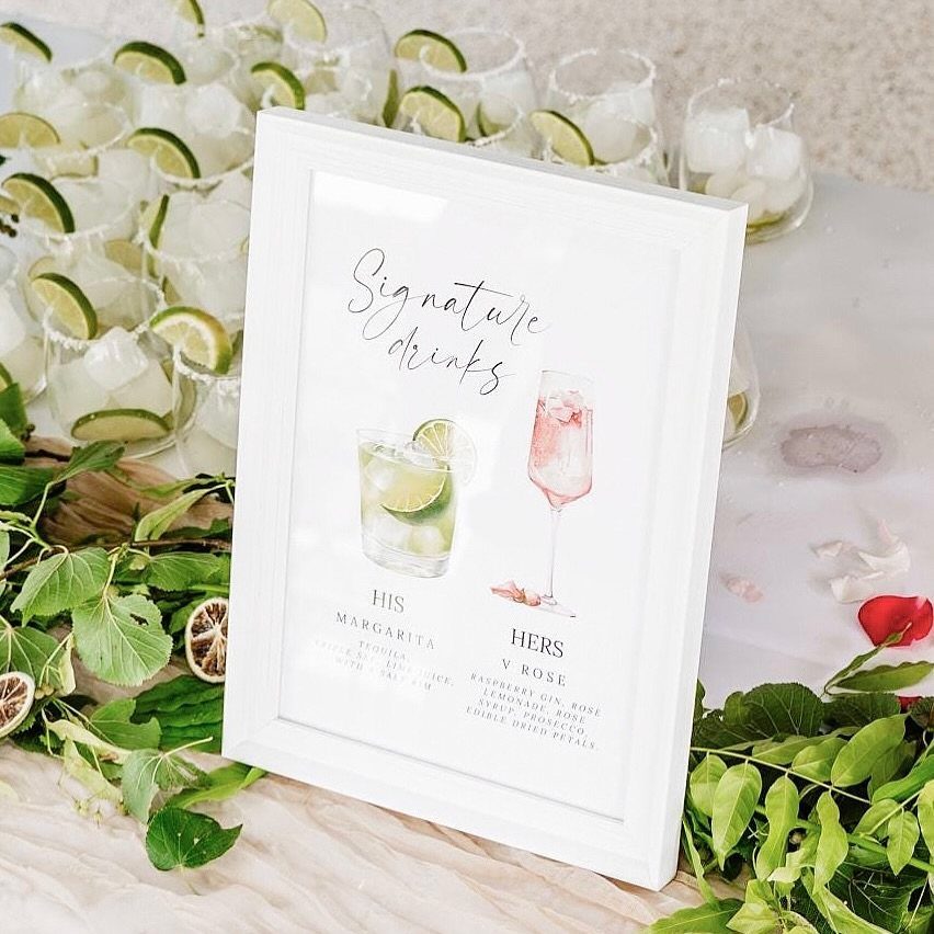 Signature drinks sign next to glasses of ice and lime slices with greenery