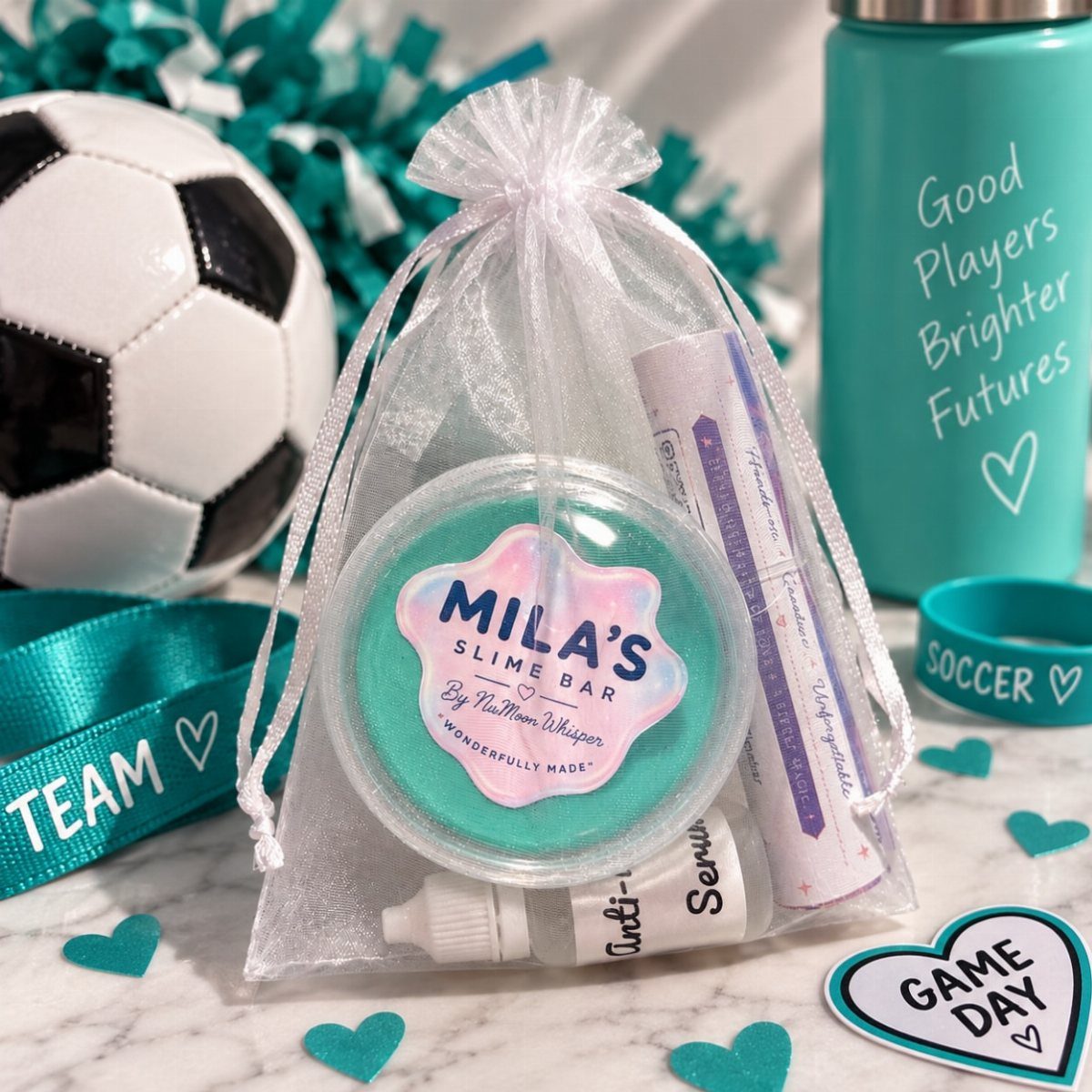 Green slime in a clear bag with a soccer ball and teal accessories.