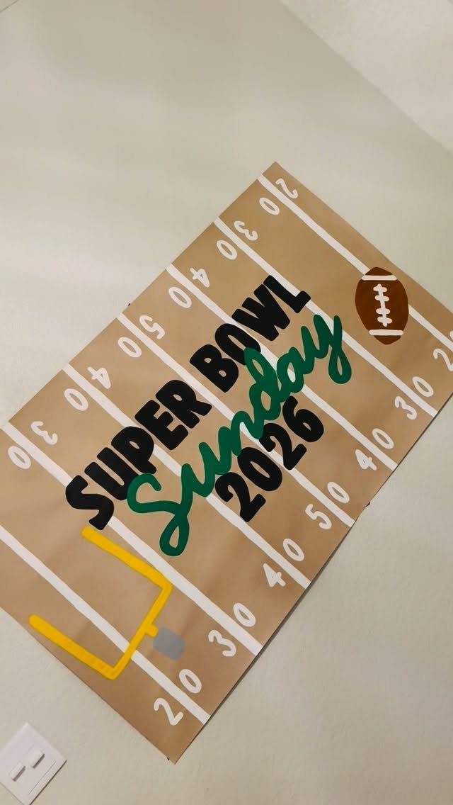 Football field themed sign for Super Bowl Sunday 2026 with goalpost and football.