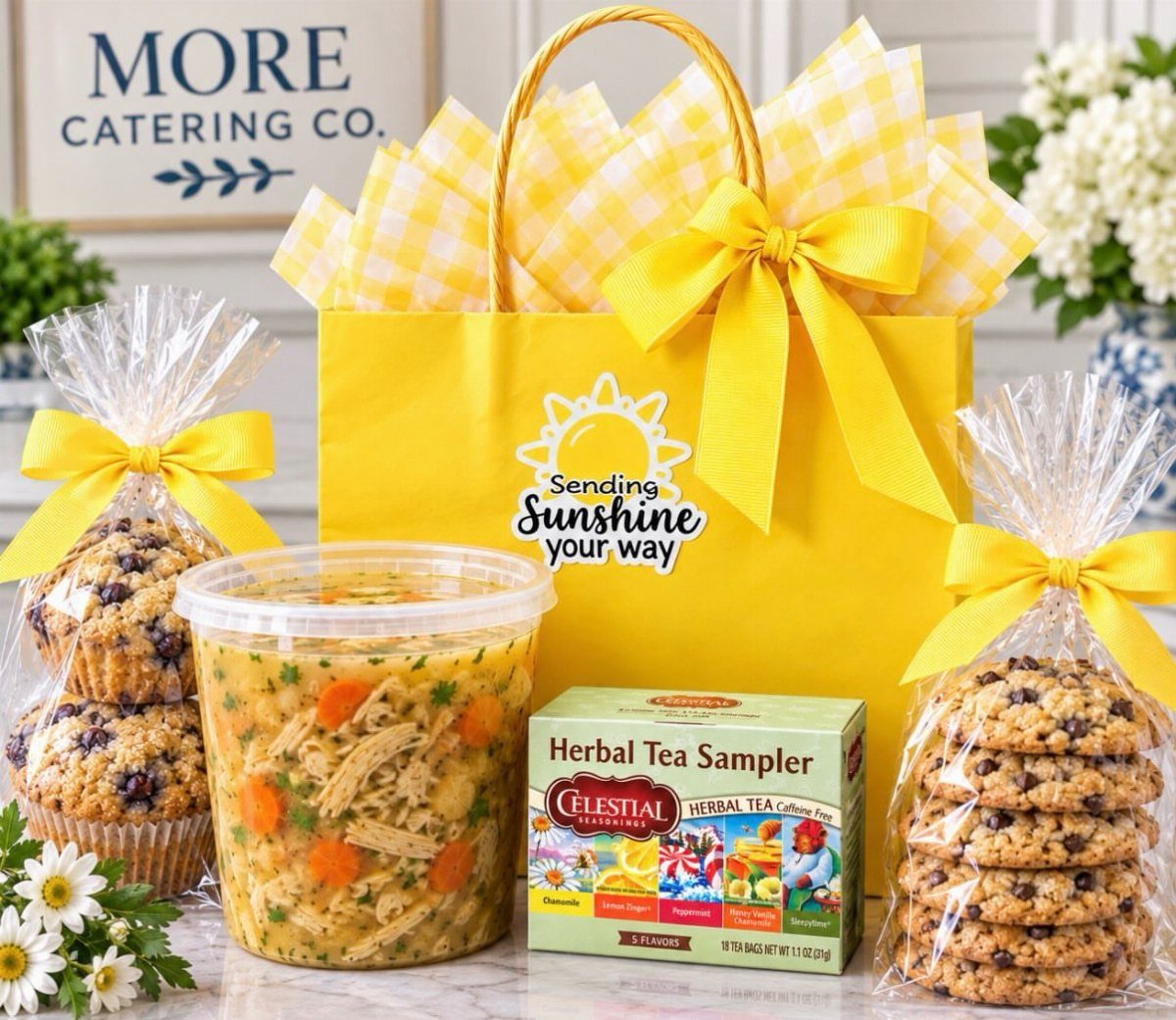Yellow gift bag with chicken vegetable soup, herbal tea, cookies, and muffins.