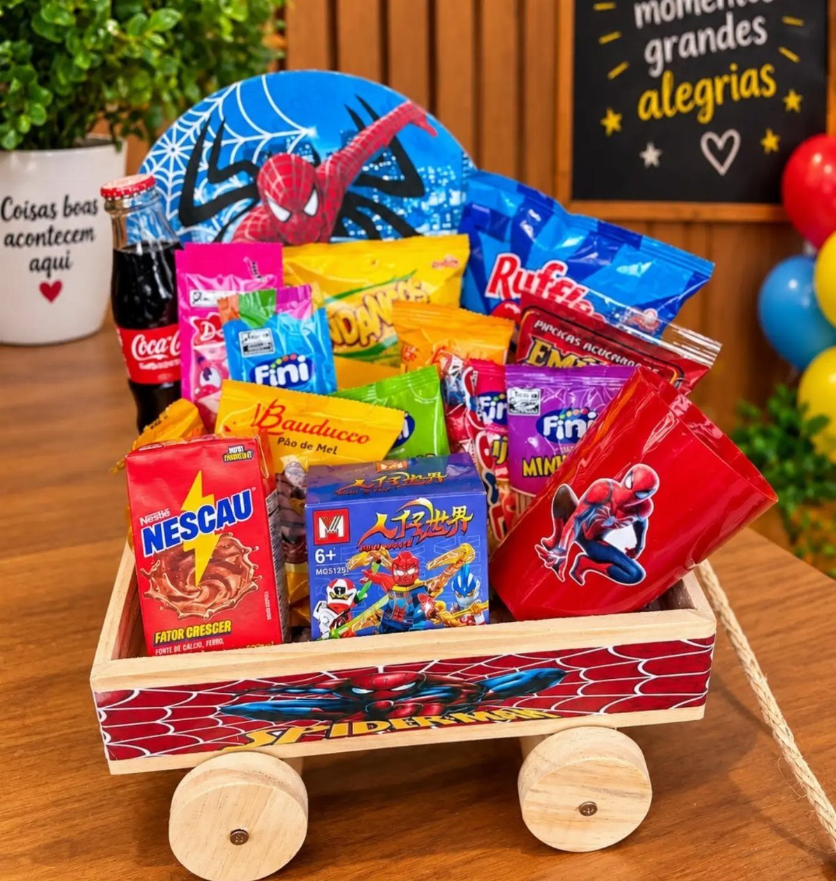 Spider-Man themed gift wagon filled with colorful candies, snacks, and a soda bottle.
