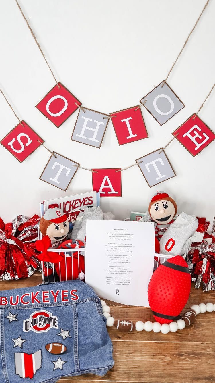 Ohio State Buckeyes themed gift basket with football, plushies, and denim jacket.