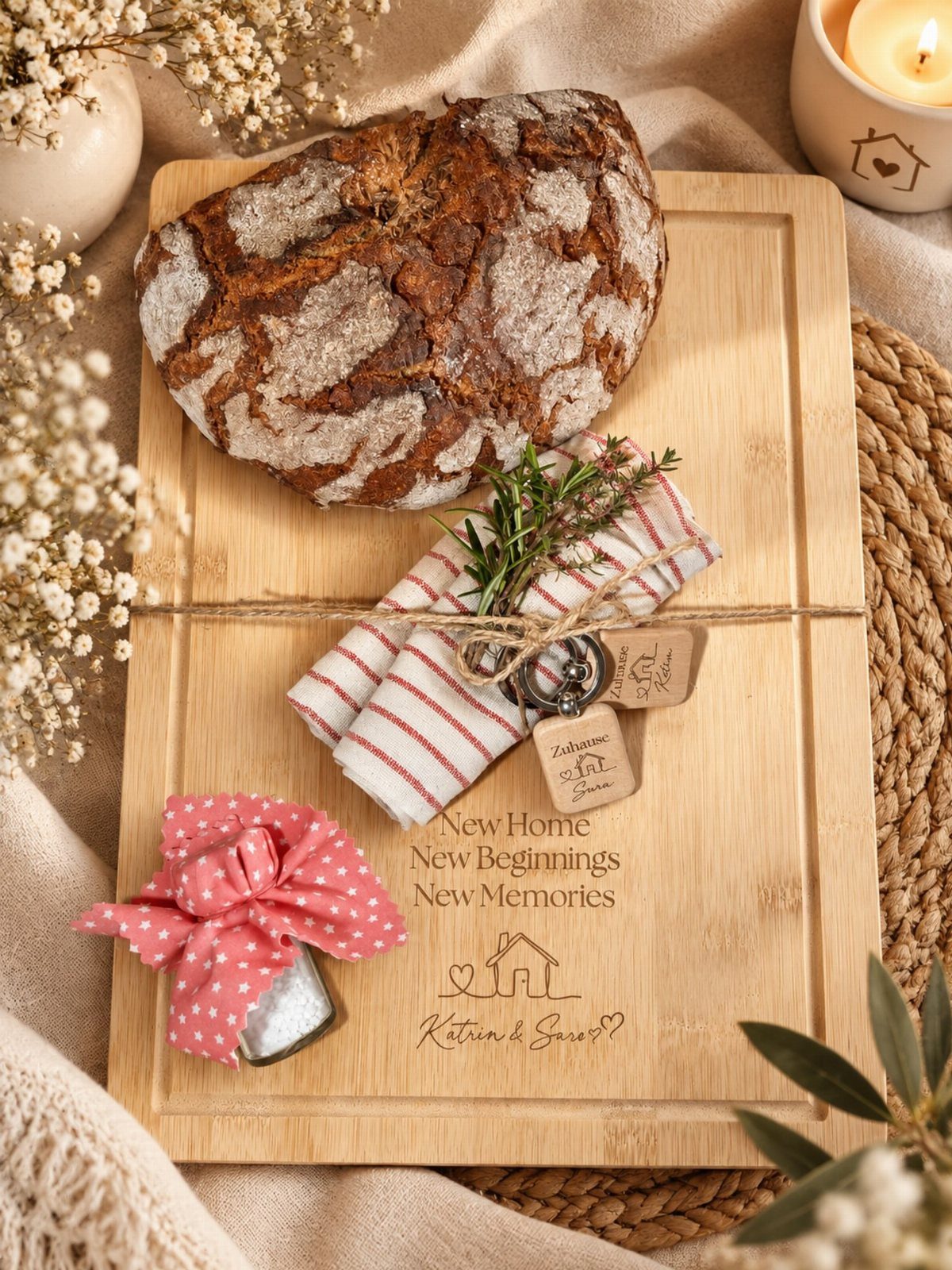 Sourdough bread loaf on an engraved wooden board with a striped napkin and jar.