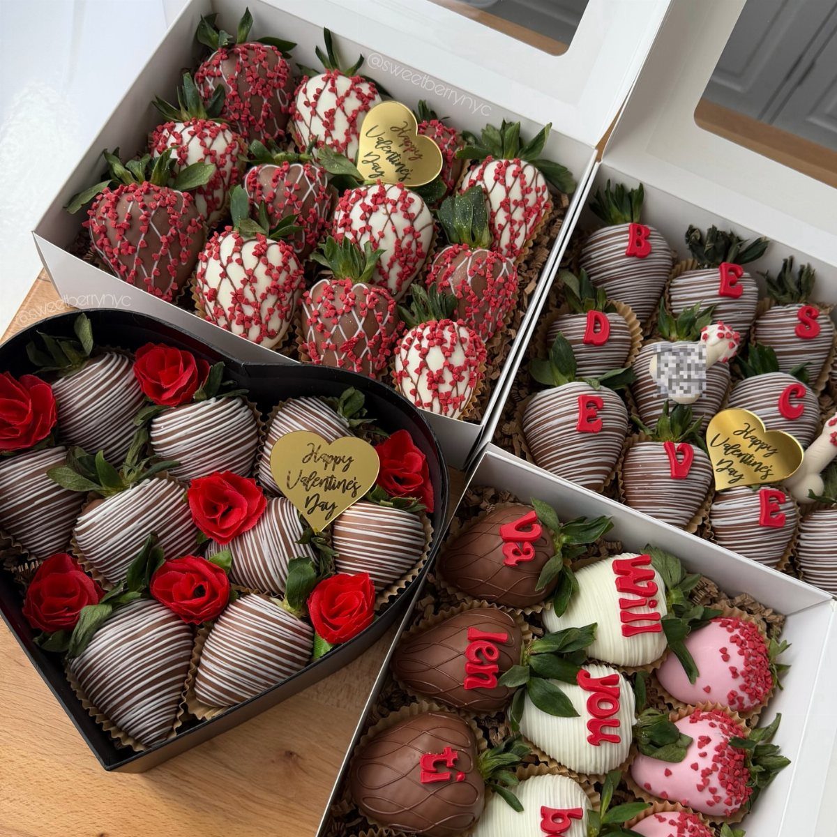Chocolate-covered strawberries in heart and rectangular boxes decorated with red roses and letters.